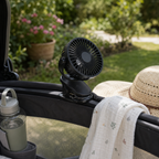 ClipCool clip fan attached safely to pram or travel cot frame